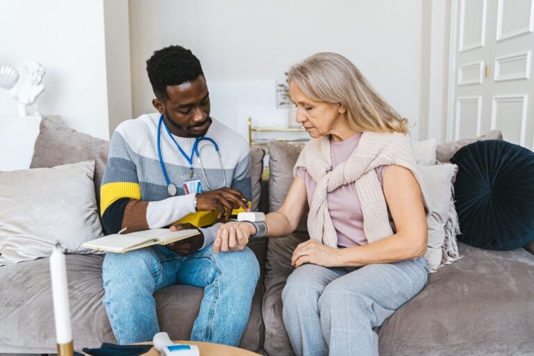 Home health taking elderly blood pressure in a Phoenix home